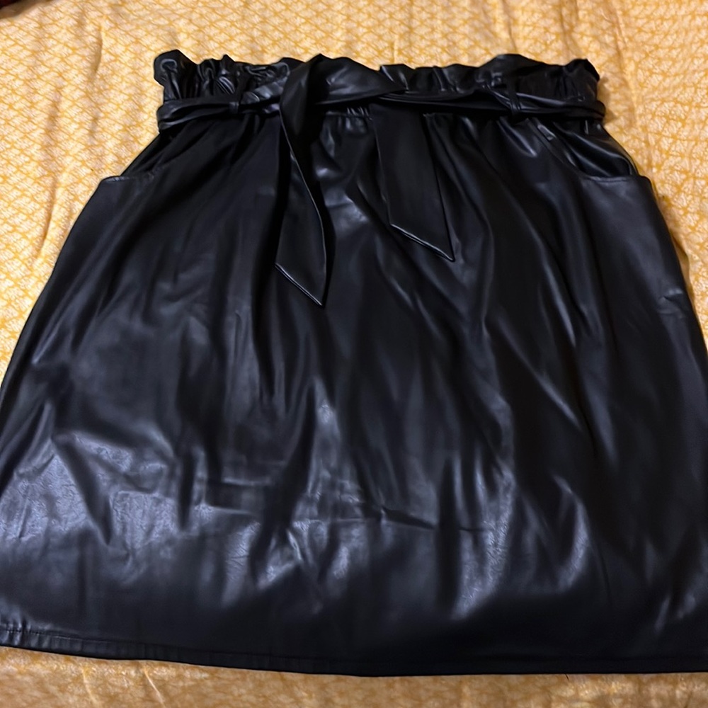 Size 22 black faux leather skirt, knee length, paper bag waist, belt and pockets